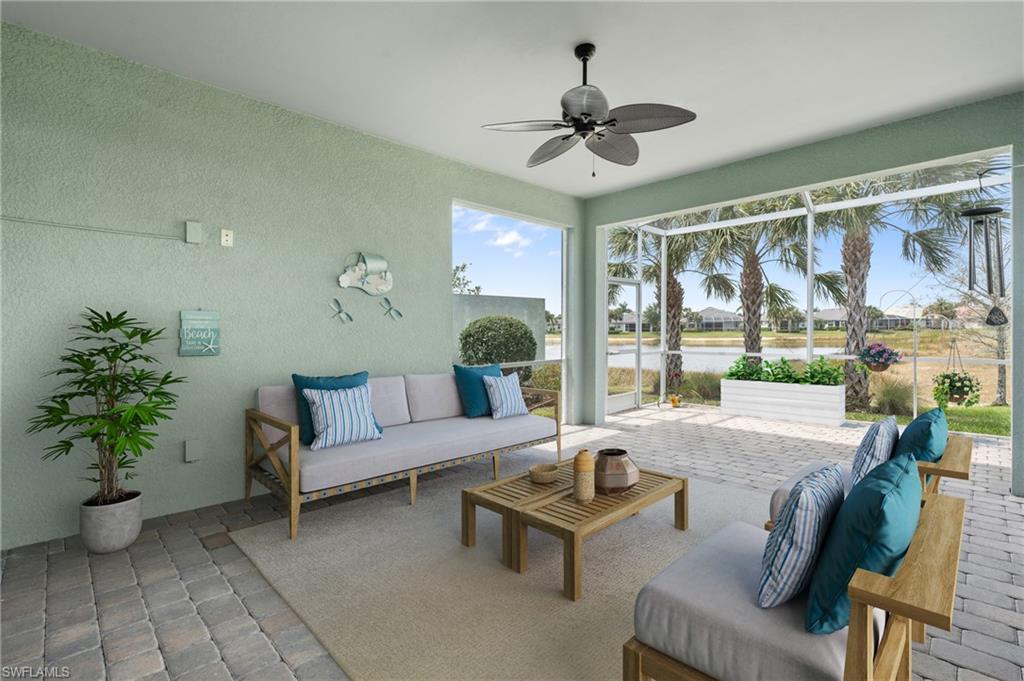 20128 Torch Key Way Estero, FL 33928 - Photo 27 of 50 a living room with furniture and a large window