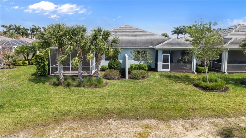 20128 Torch Key Way Estero, FL 33928 - Photo 33 of 50 a view of a house with backyard and sitting area