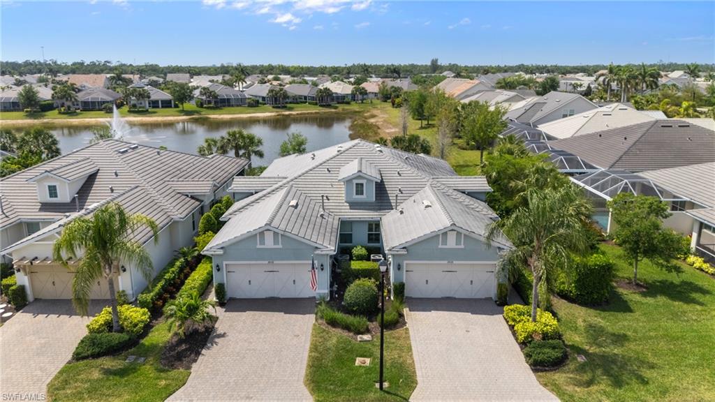 20128 Torch Key Way Estero, FL 33928 - Photo 35 of 50 an aerial view of a house with outdoor space and lake view