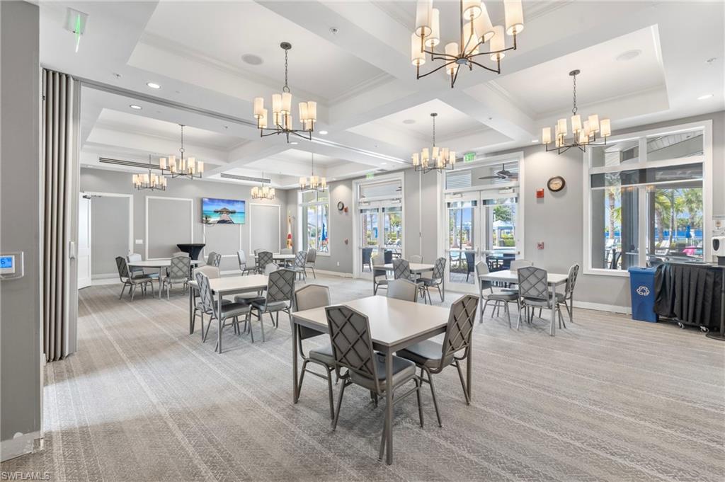 20128 Torch Key Way Estero, FL 33928 - Photo 41 of 50 a view of a dining room with furniture window and wooden floor