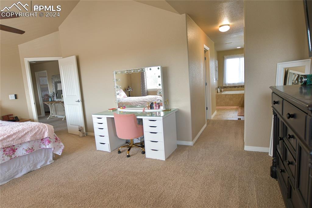 6290 Bearcat Loop Colorado Springs, CO 80925 - Photo 28 of 49 a room with a bed and a cabinets