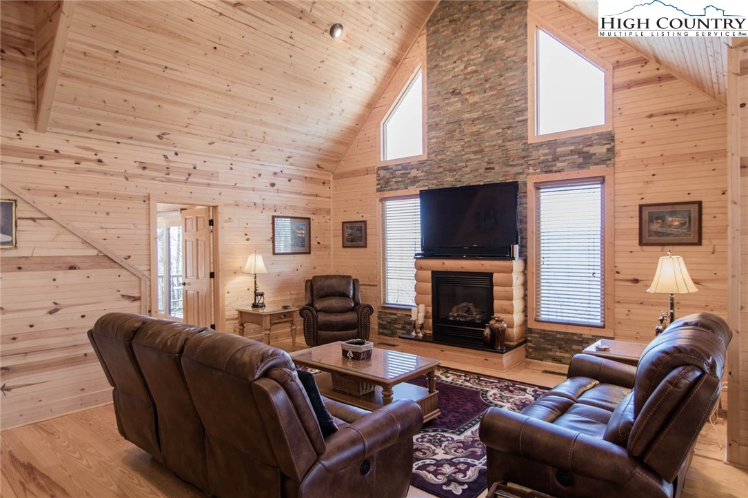 308 Warren Way Road Purlear, NC 28665 - Photo 14 of 49 a living room with furniture and a fireplace