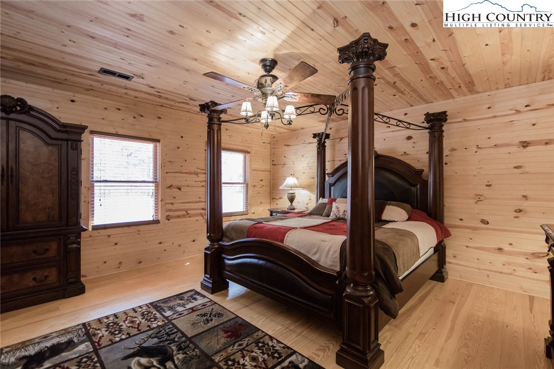 308 Warren Way Road Purlear, NC 28665 - Photo 25 of 49 a bedroom with a bed dresser and a window