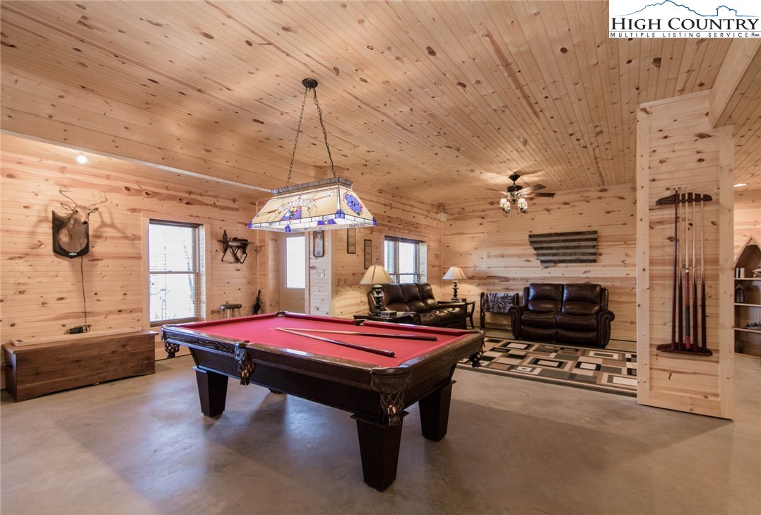 308 Warren Way Road Purlear, NC 28665 - Photo 38 of 49 a bed room with furniture and a chandelier