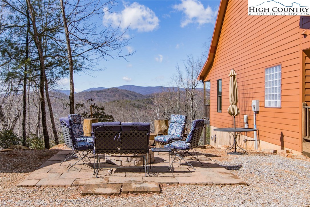 308 Warren Way Road Purlear, NC 28665 - Photo 6 of 49 a view of backyard with seating space and trees