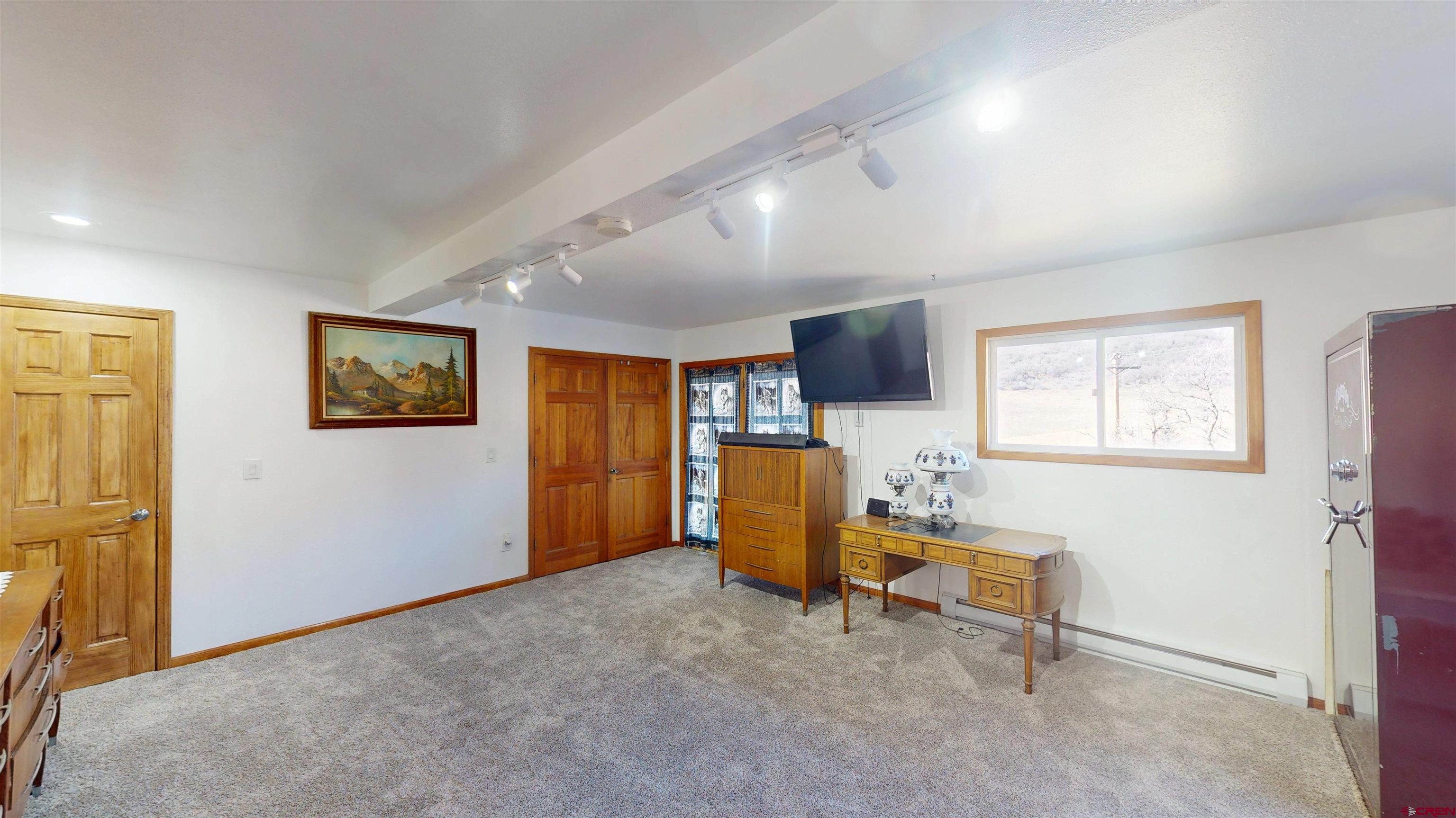 19253 Stevens Gulch Road Paonia, CO 81428 - Photo 15 of 43 a view of a livingroom with furniture and a window