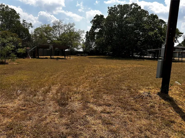 a view of outdoor space with deck and trees