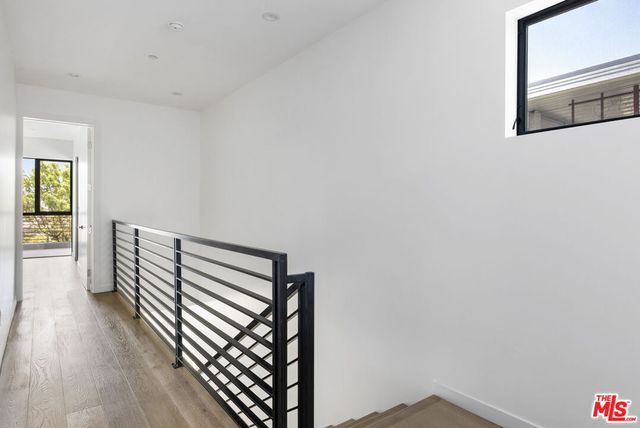 a view of a room with wooden floor
