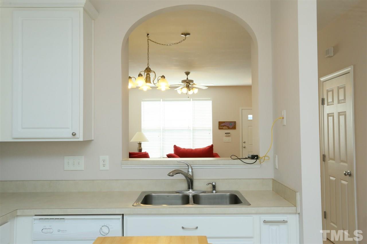 8228 City Loft Court Raleigh, NC 27613 - Photo 11 of 27 a bathroom with a sink and a mirror