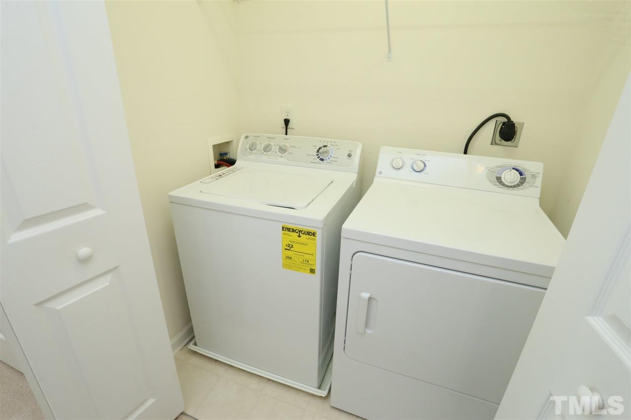 8228 City Loft Court Raleigh, NC 27613 - Photo 16 of 27 a utility room with dryer and washer