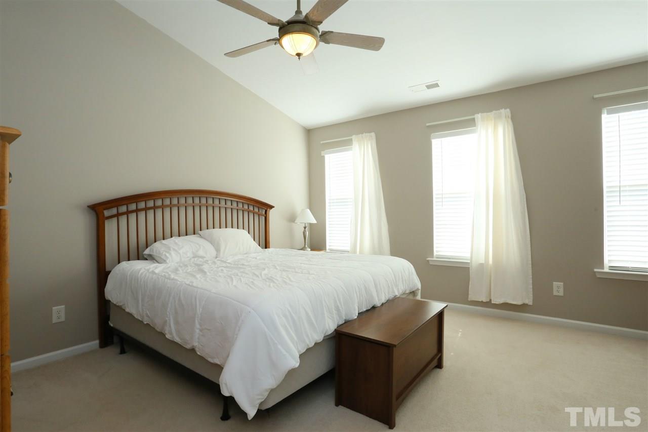 8228 City Loft Court Raleigh, NC 27613 - Photo 17 of 27 a bedroom with a bed and window