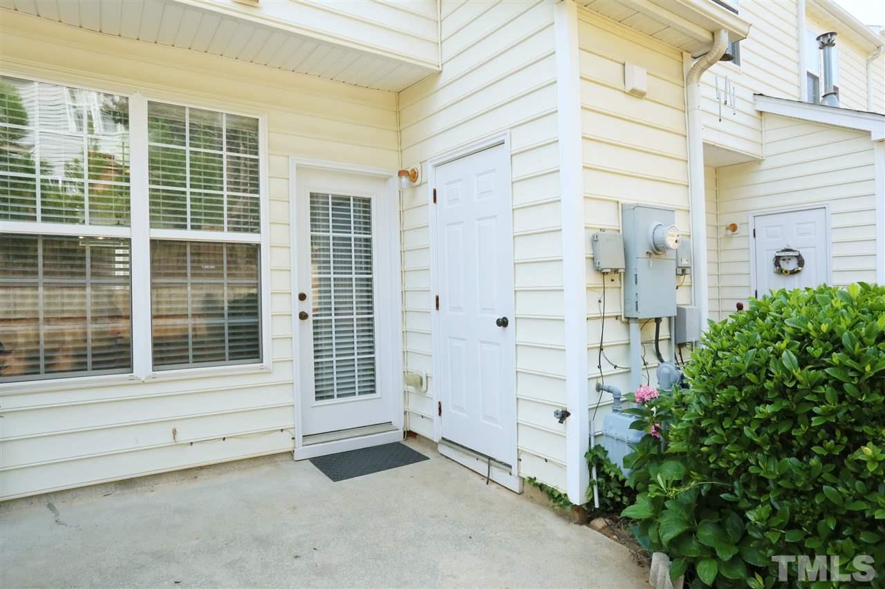 8228 City Loft Court Raleigh, NC 27613 - Photo 24 of 27 a view of a brick house with windows