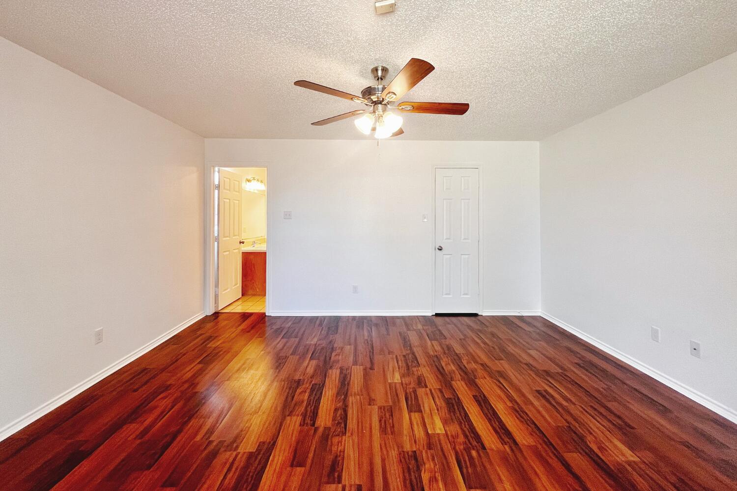 6114 10th Street Lubbock, TX 79416 - Photo 12 of 24 a view of empty room with wooden floor