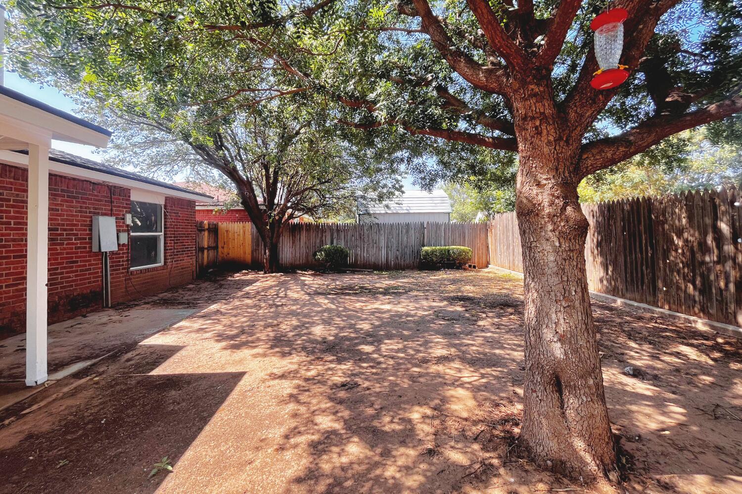 6114 10th Street Lubbock, TX 79416 - Photo 24 of 24 a view of a house with a yard