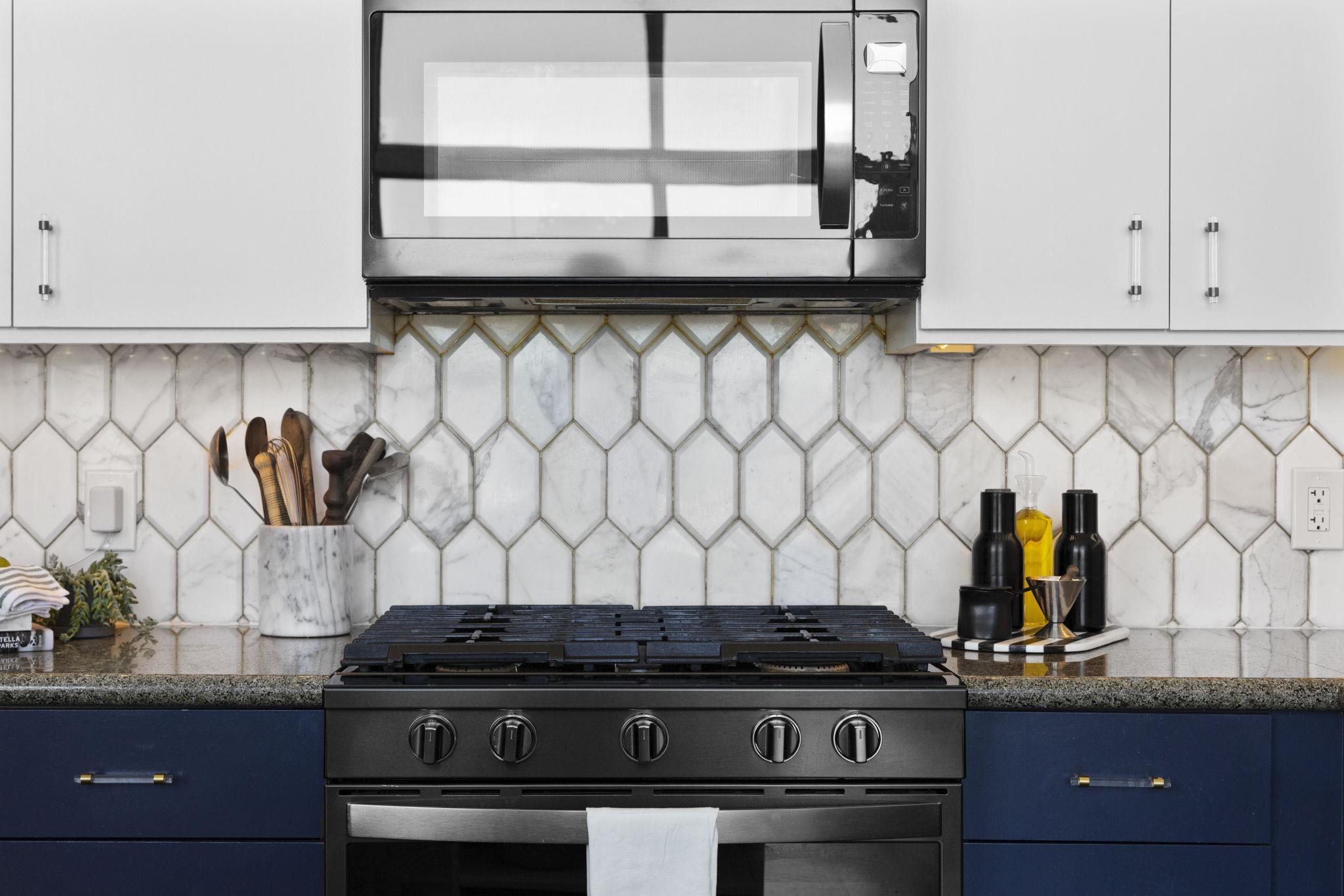 1007 41st Street, Unit 334 Oakland, CA 94608 - Photo 17 of 59 a stove top oven sitting inside of a kitchen