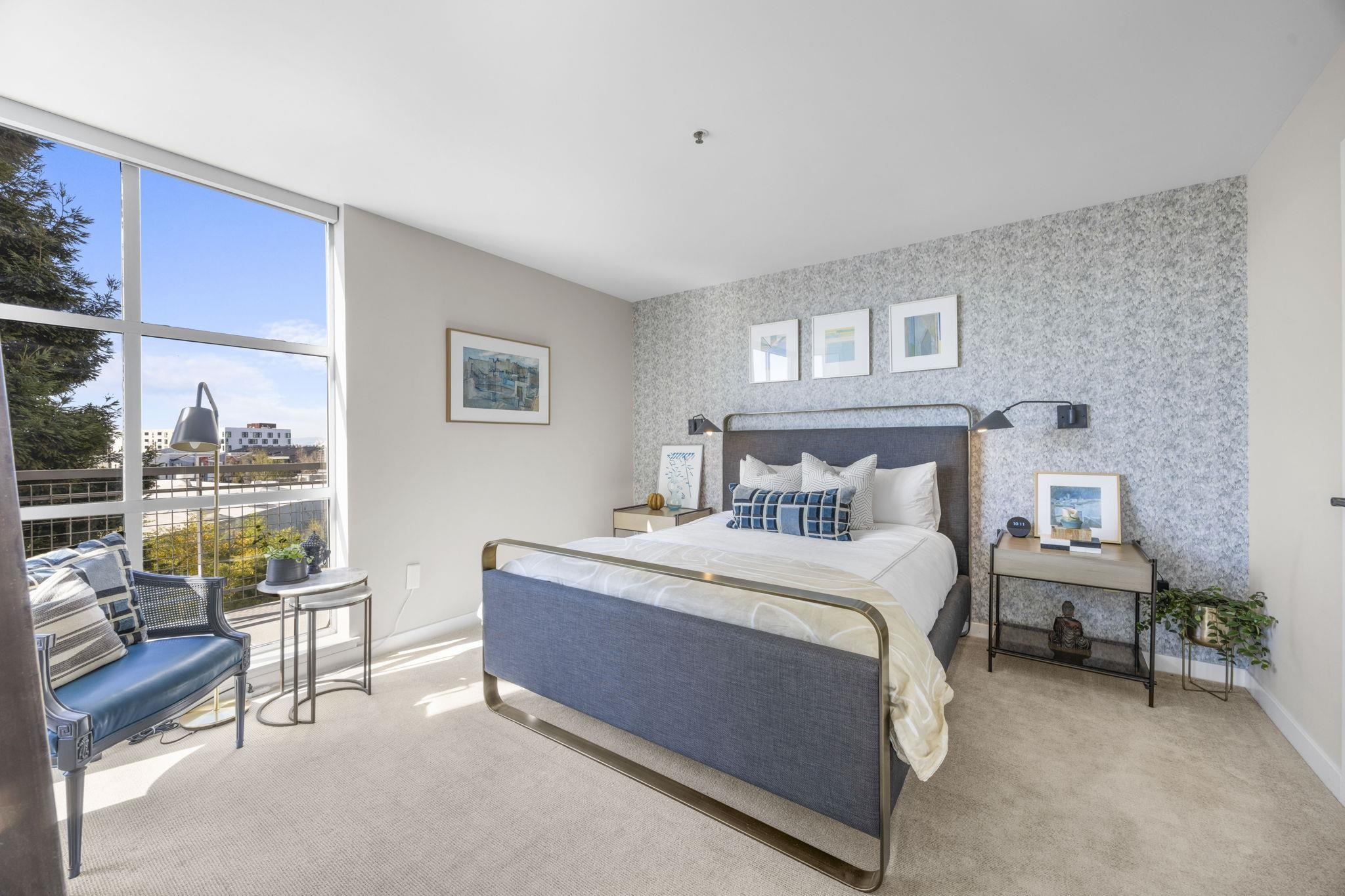 1007 41st Street, Unit 334 Oakland, CA 94608 - Photo 23 of 59 a bed room with a bed and a couch