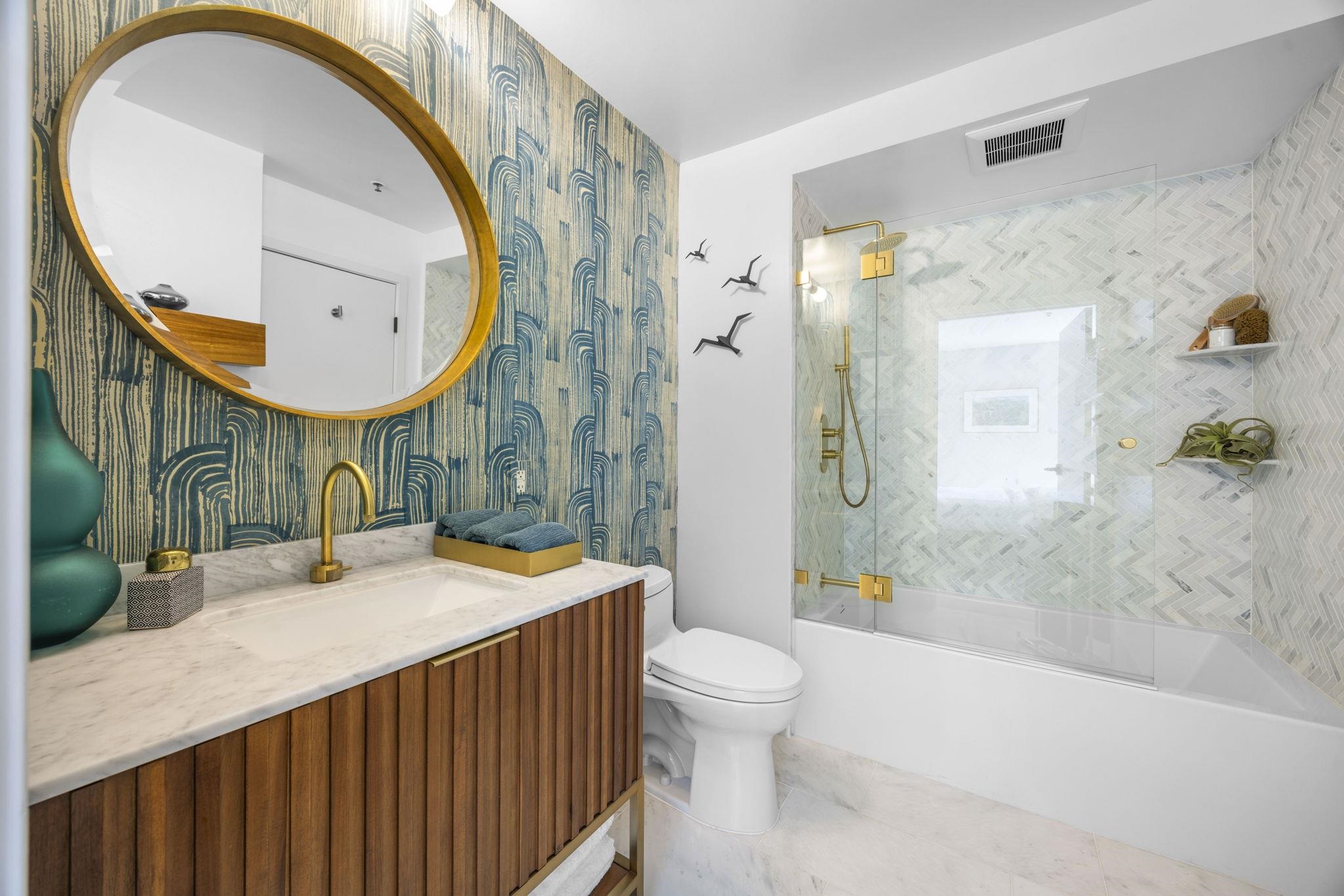 1007 41st Street, Unit 334 Oakland, CA 94608 - Photo 27 of 59 a bathroom with a sink a mirror and a toilet
