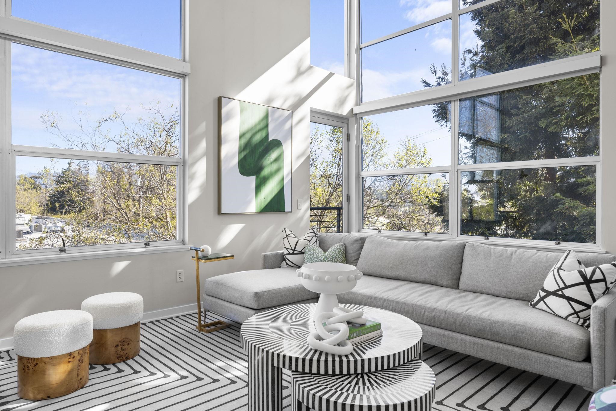 1007 41st Street, Unit 334 Oakland, CA 94608 - Photo 6 of 59 a living room with furniture and a large window