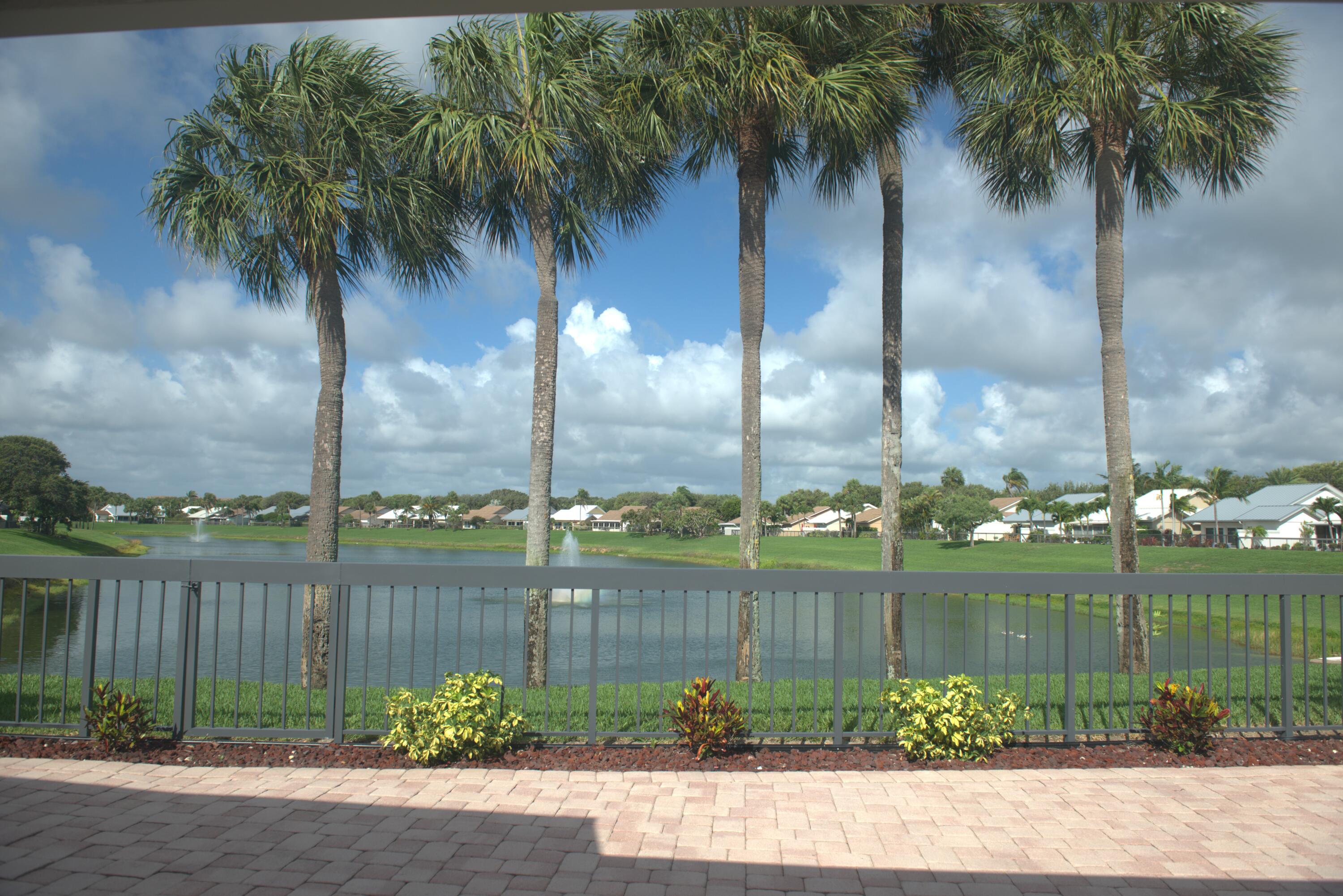 114 Beach Summit Court Jupiter, FL 33477 - Photo 6 of 32 a view of ocean with a palm tree