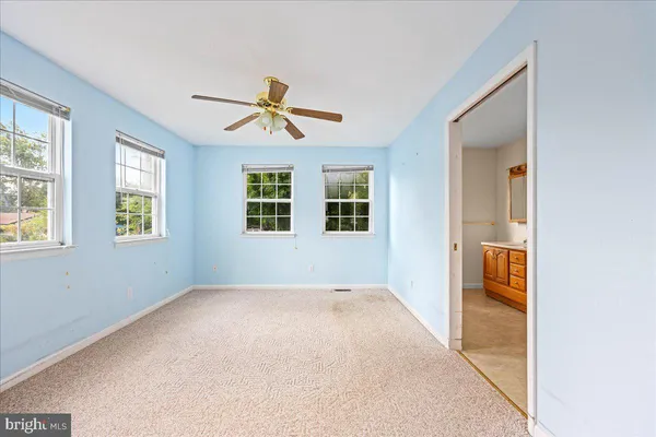 a view of empty room with windows