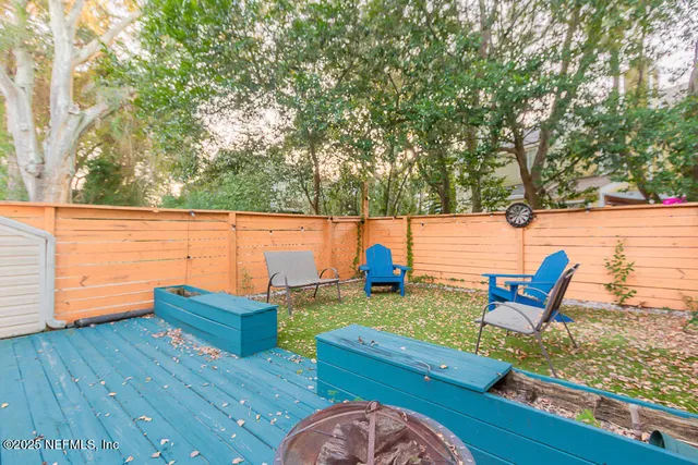 a white toilet and tub sitting next to a bathroom sink