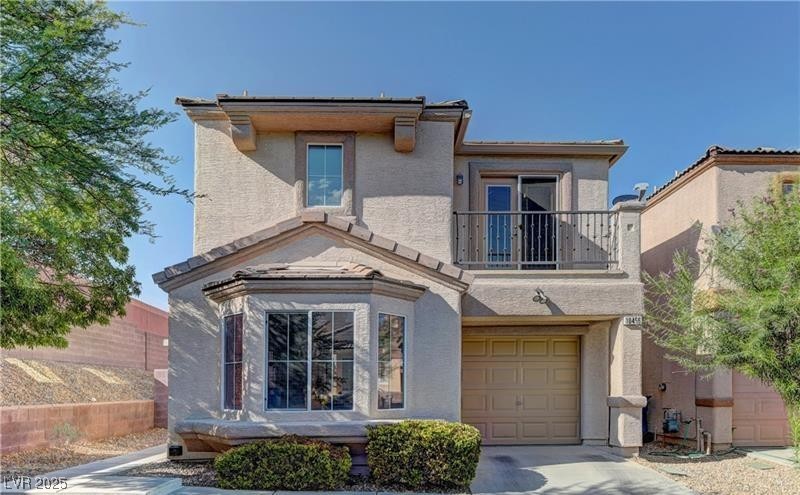 10456 Processor Court Las Vegas, NV 89129 - Photo 1 of 8 Traditional home featuring an attached garage, dri
