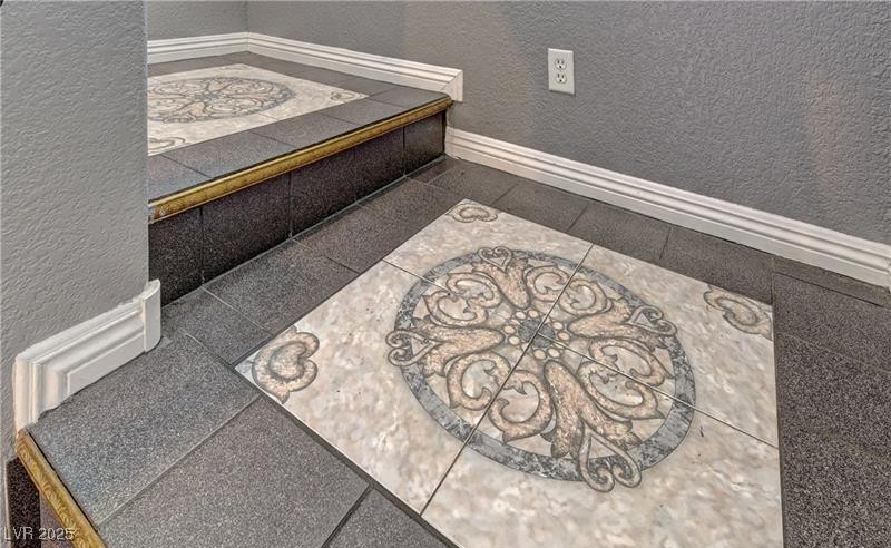 10456 Processor Court Las Vegas, NV 89129 - Photo 6 of 8 Room details with baseboards and a textured wall