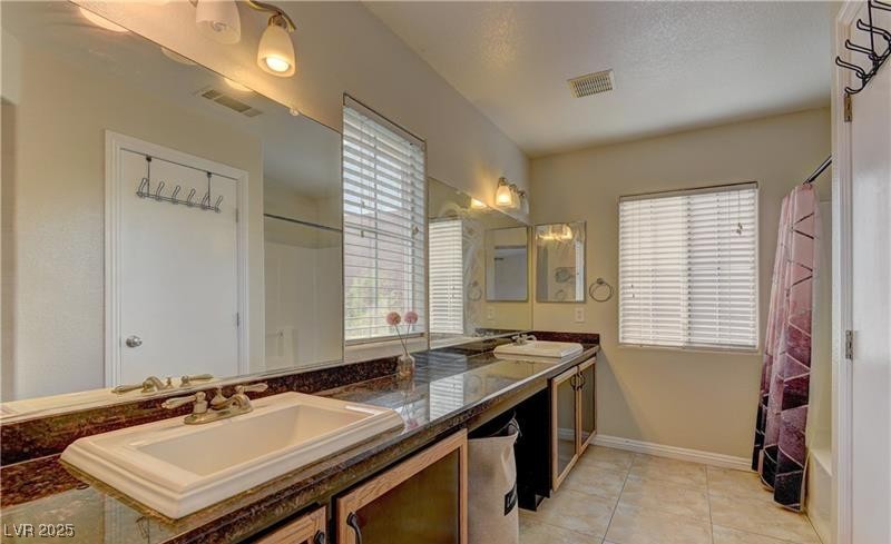 10456 Processor Court Las Vegas, NV 89129 - Photo 8 of 8 Full bathroom featuring a sink, tile patterned flo