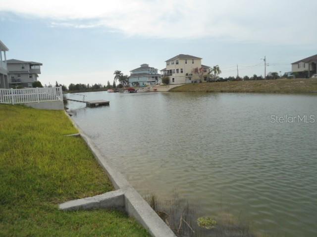 3415 Triggerfish Drive Hernando Beach, FL 34607 - Photo 3 of 4 a view of a lake with houses