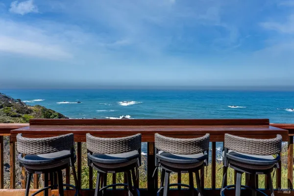 a view of a balcony with an ocean view