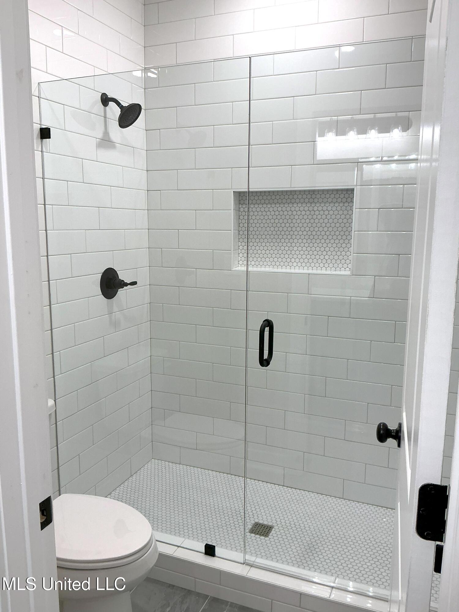 9069 Bennett Trail Hernando, MS 38632 - Photo 9 of 24 Down Hall Bathroom Shower