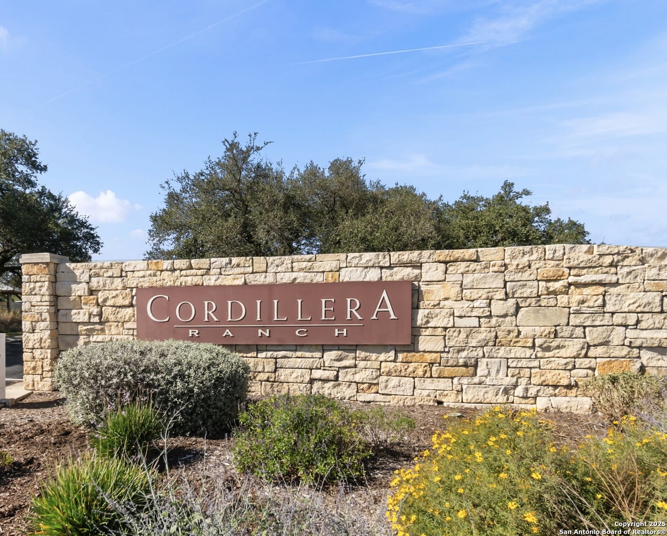 Lot 13 Sendero Ridge Boerne, TX 78006 - Photo 5 of 15 a sign board with tall buildings in the background