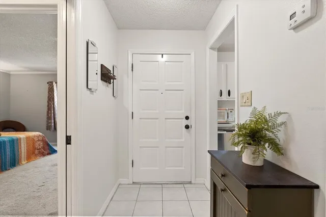 a bedroom with a bed a table and a window