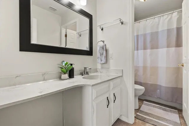 a bedroom with two beds and a window