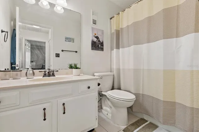 a dining room filled with glass windows and furniture