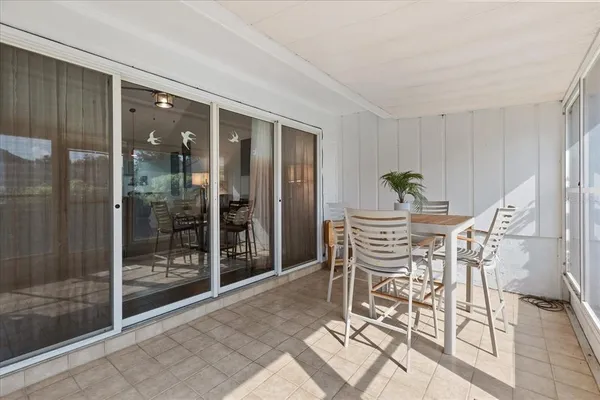 a view of a pathway with flower plants