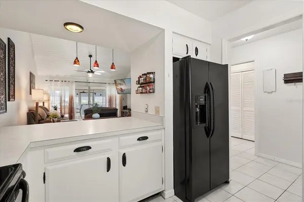 a kitchen with stainless steel appliances a refrigerator and cabinets