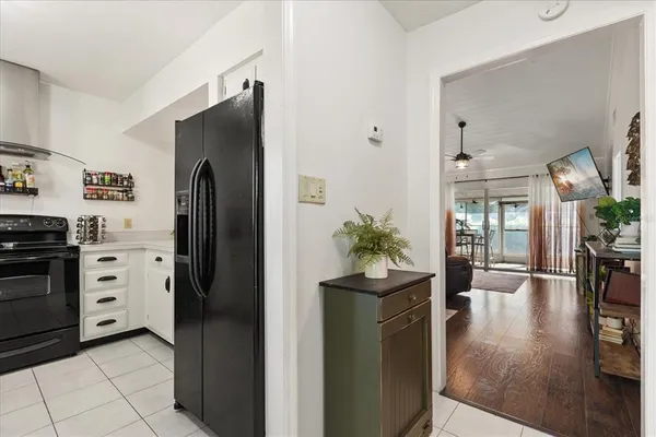 a kitchen with stainless steel appliances kitchen island granite countertop a refrigerator and a stove