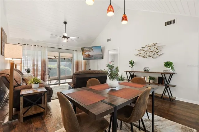a view of a dining room with furniture window and wooden floor