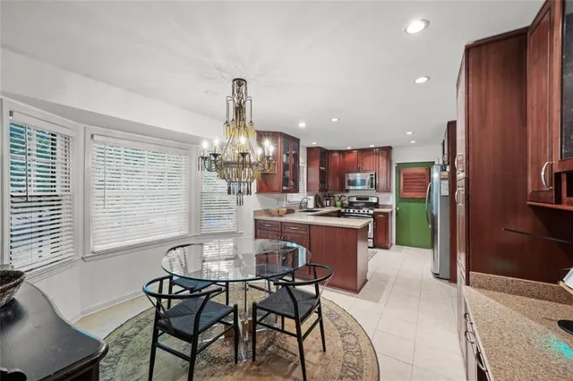 a kitchen with a table and chairs in it
