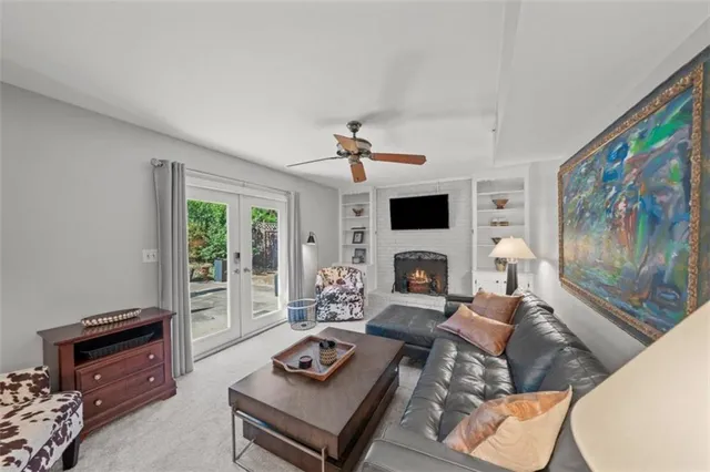 a living room with furniture fireplace and a flat screen tv