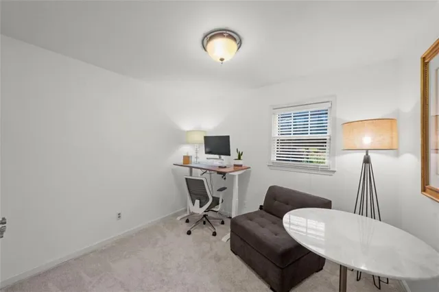 a workspace with furniture and a lamp