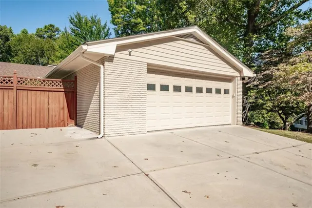 a view of small house with backyard