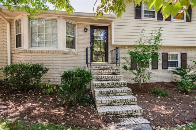 front view of a house with a bench