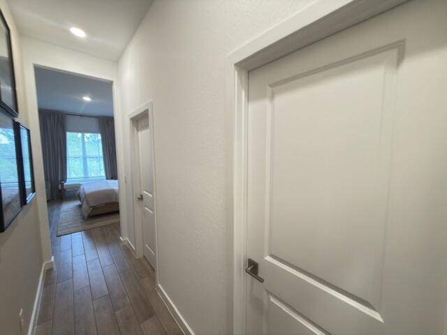 19696 Weathervane Way Loxahatchee, FL 33470 - Photo 14 of 39 a view of a hallway with wooden floor and furniture