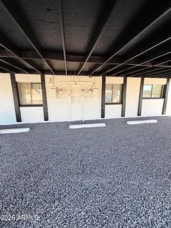a view of an empty room and a window