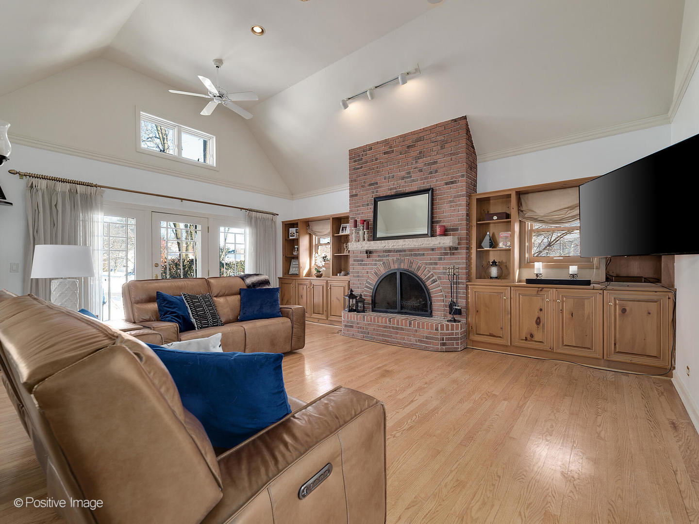 213 Woodside Road Riverside, IL 60546 - Photo 12 of 35 a living room with furniture a flat screen tv and a fireplace