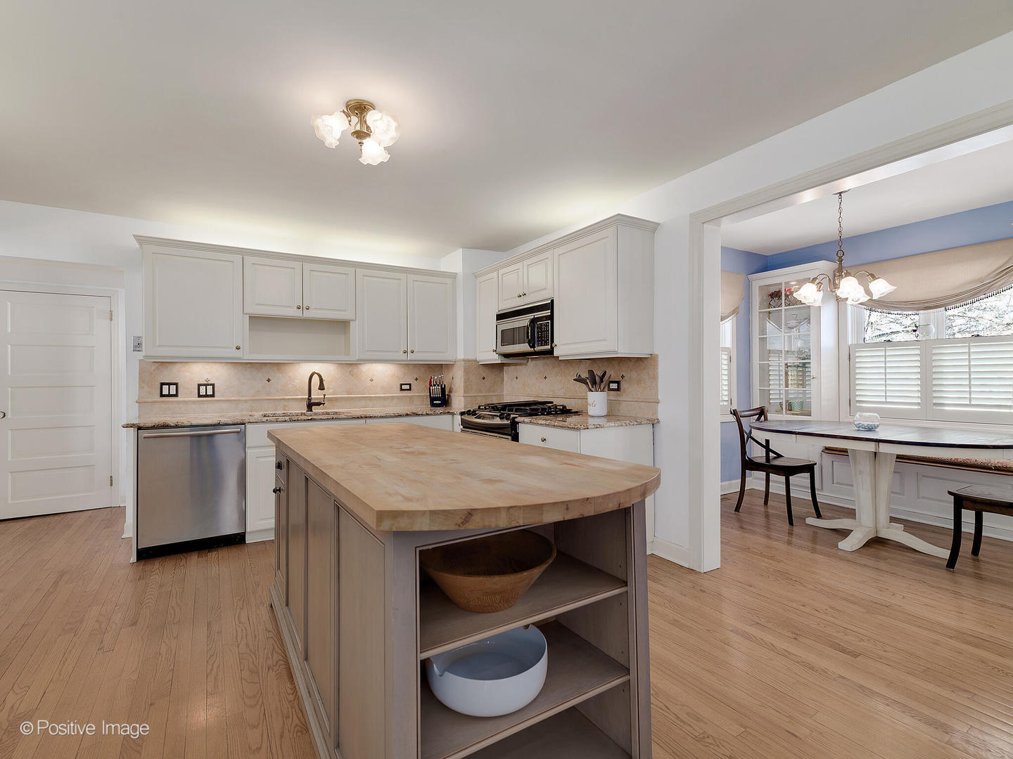 213 Woodside Road Riverside, IL 60546 - Photo 16 of 35 a view of kitchen with sink and wooden floor