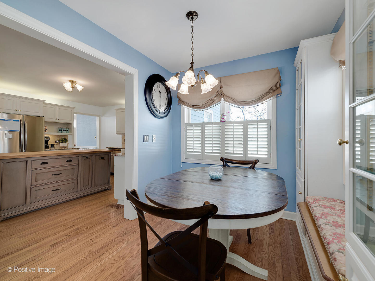 213 Woodside Road Riverside, IL 60546 - Photo 19 of 35 a view of a dining room and chandelier fan