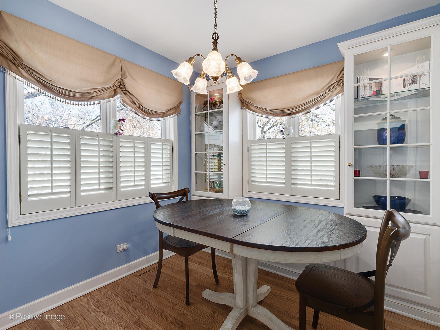 213 Woodside Road Riverside, IL 60546 - Photo 20 of 35 a view of a dining room with furniture and a chandelier